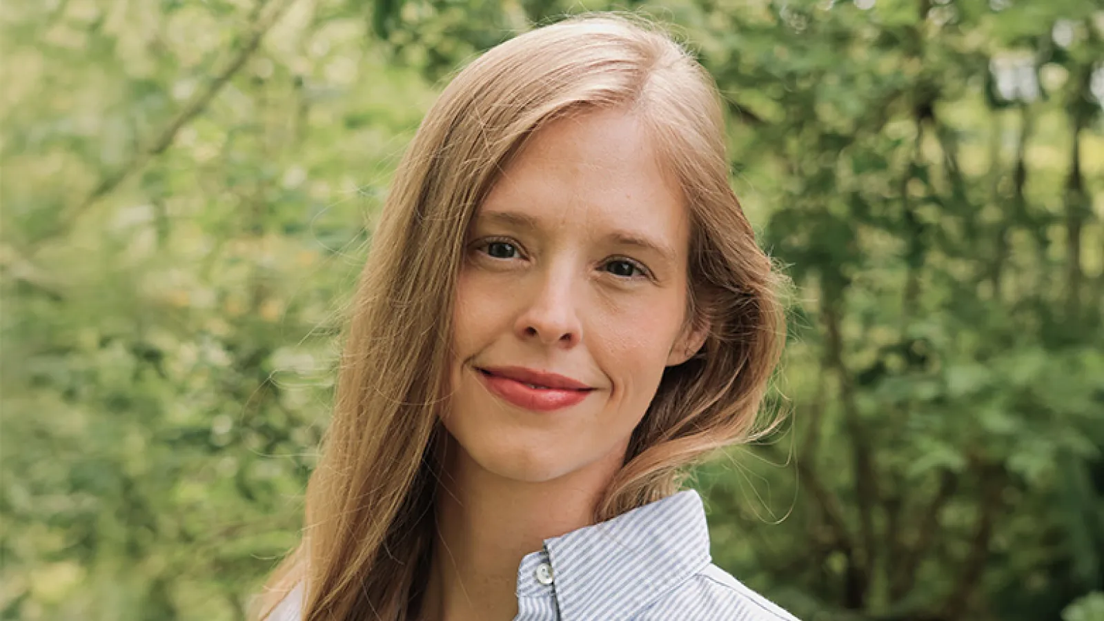 A woman with blond hair and blue eyes.