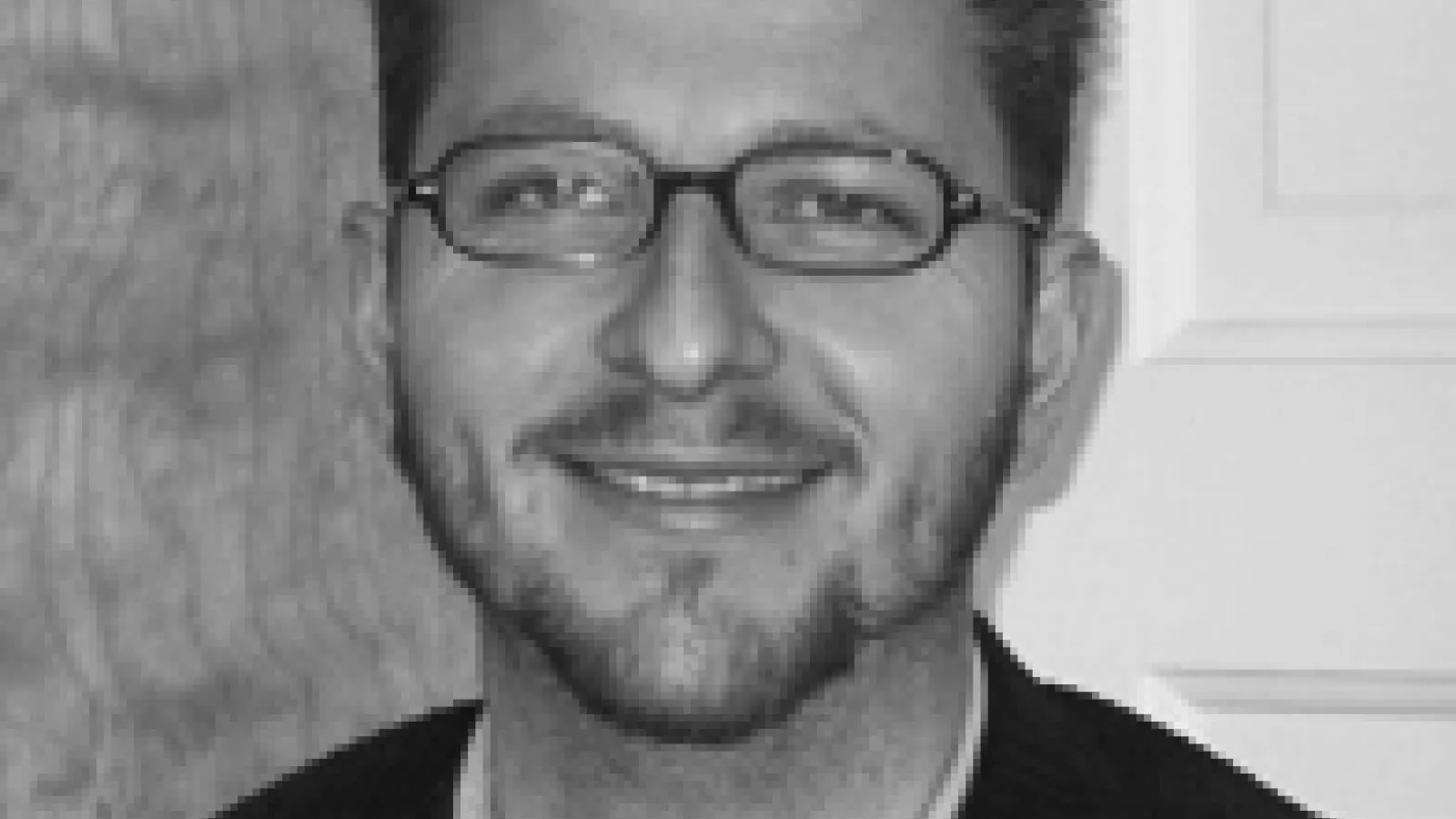 Head shot of Fernando Riosmena in black and white format.